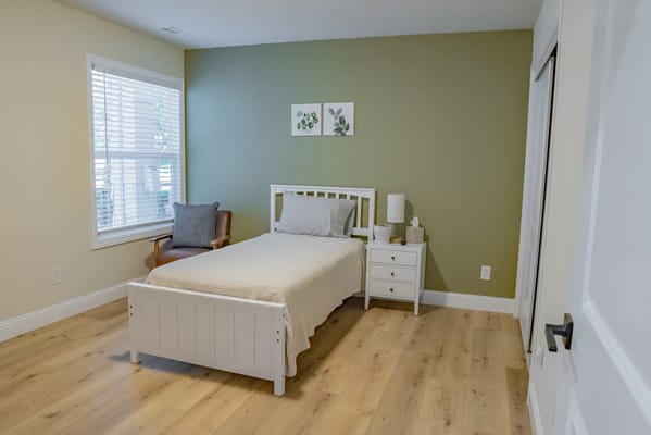 A cozy bedroom setup in a senior living space