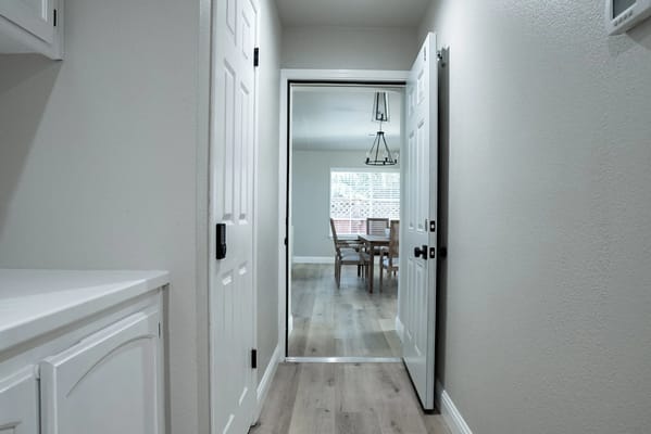 Bright interior hallway with a view of the dining area