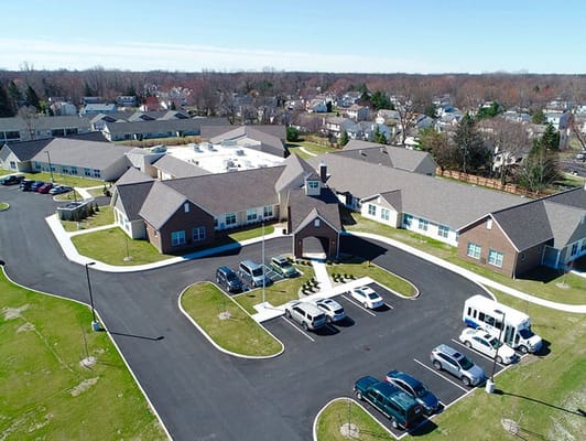 Aerial view of Charter Senior Living facility with parking area