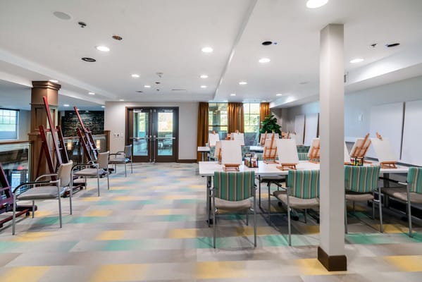 Bright interior of an activity room with easels