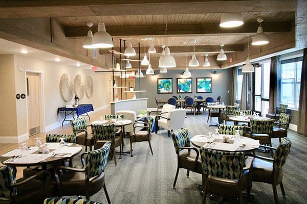 Bright dining area with colorful chairs and tables