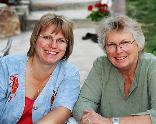 Two women smiling together outdoors