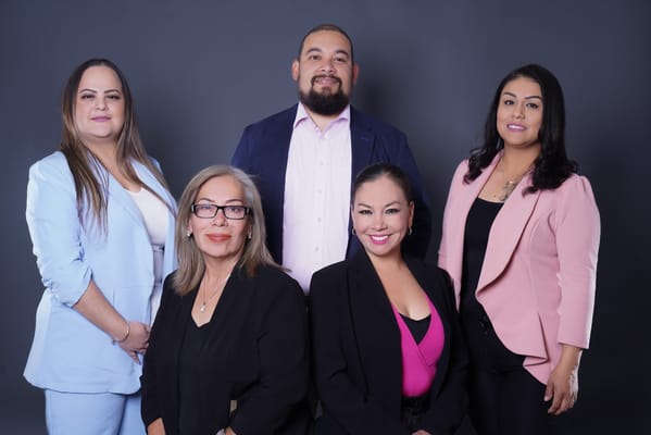 Staff members posing together for a professional photo