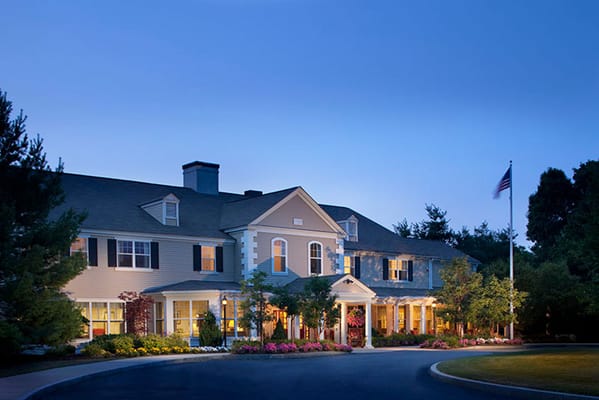 Exterior view of Welch Senior Living at dusk