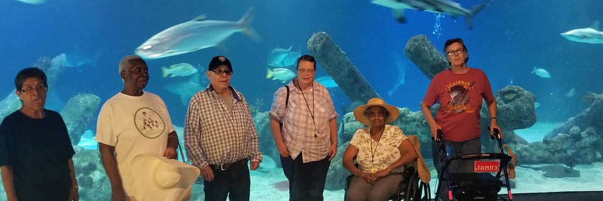 Residents enjoying a visit to an aquarium exhibit