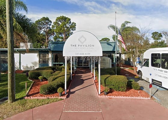 Exterior view of The Pavilion entrance with landscaping