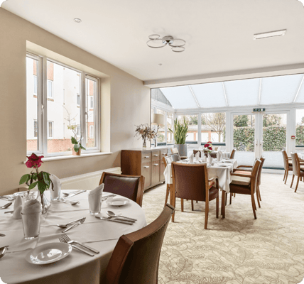 Dining room with tables set for a meal