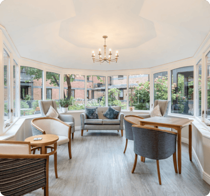 Bright common area with seating and natural light