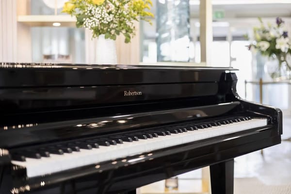 Close-up of a grand piano in a facility interior