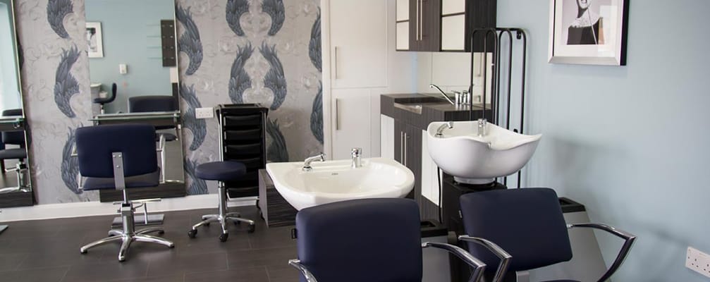 Interior of a beauty salon with chairs and sinks