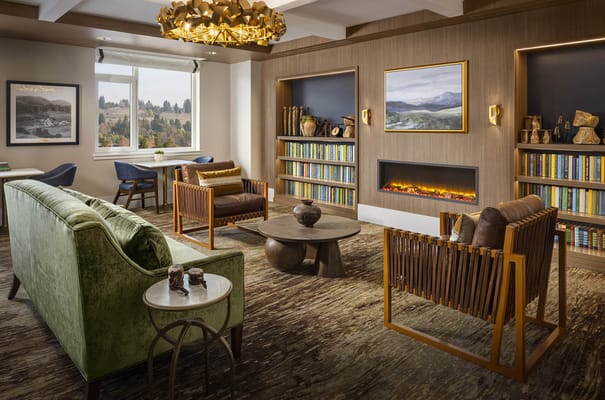 Interior common area with seating and bookshelves