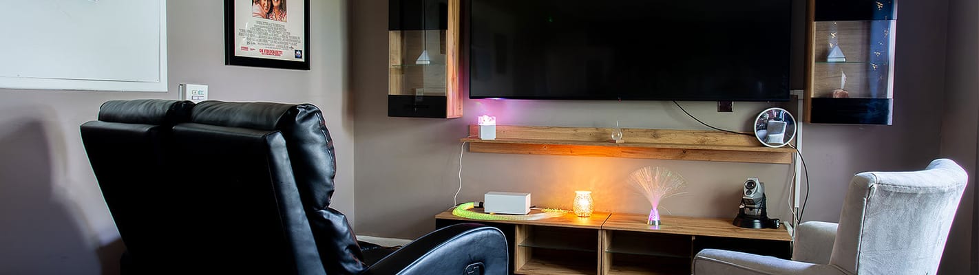 Common area with furniture and TV setup