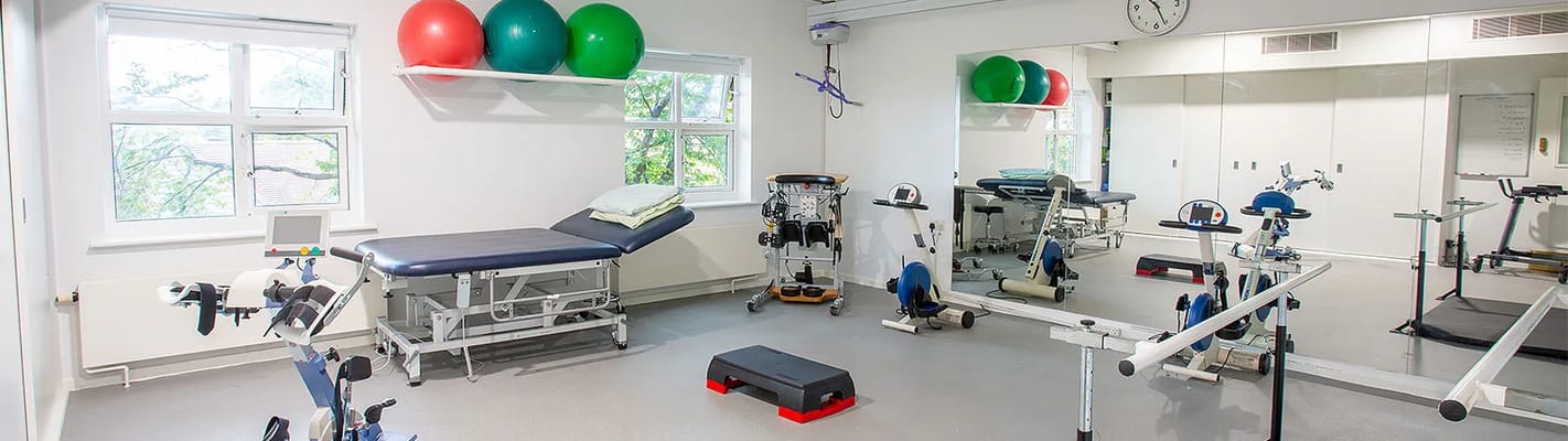 Fitness room with exercise equipment and therapy supplies