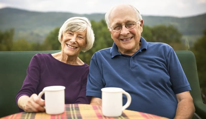 Senior couple enjoying coffee outdoors