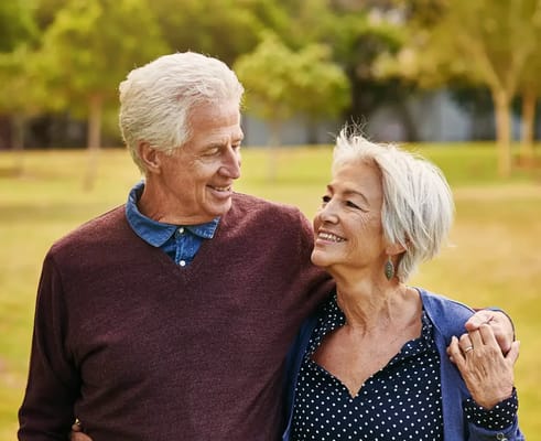 An older couple enjoying a sunny day outdoors