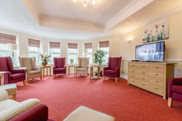 Bright common area with seating and plants