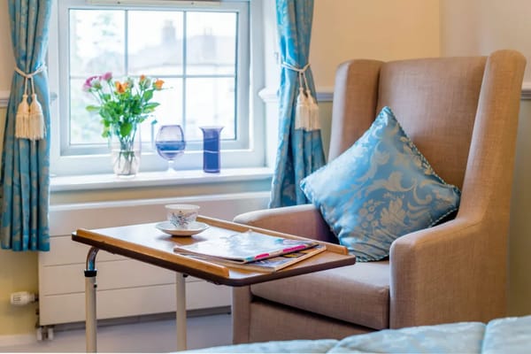 Comfortable chair by the window in a resident's room