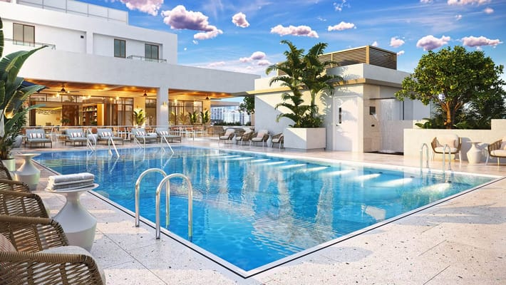 Outdoor swimming pool surrounded by lounge chairs