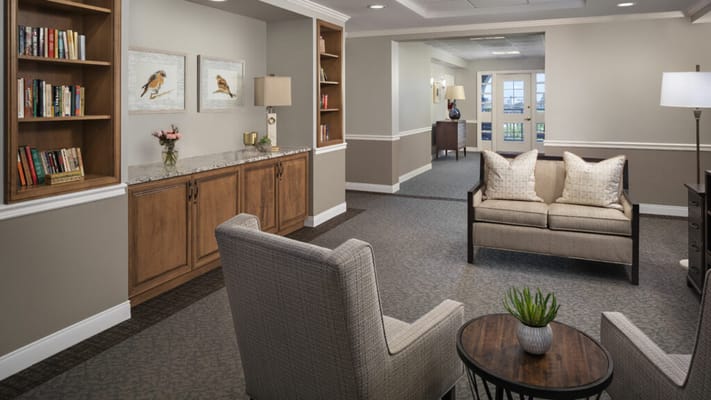 Interior common area with seating and bookshelves