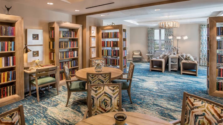 Common area with bookshelves and seating