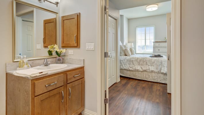 Stylish resident room with bathroom and bed