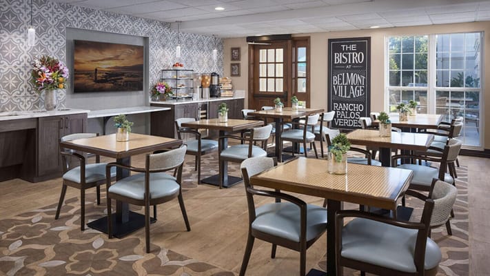 Interior dining area with tables and flowers