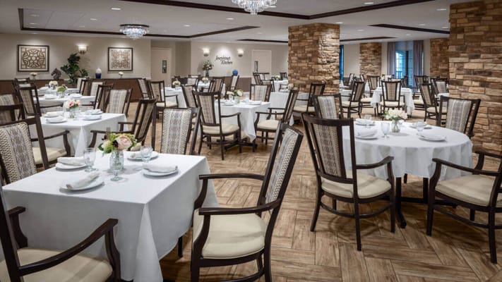 Elegant dining room setup with tables and chairs