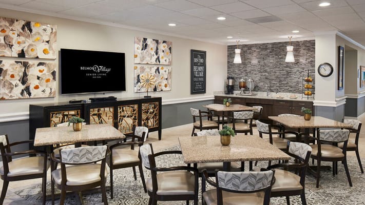 Dining area with tables and floral artwork