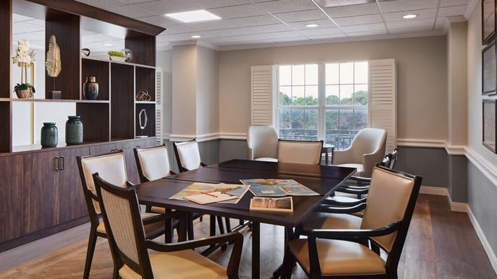 Bright common area with seating and a table