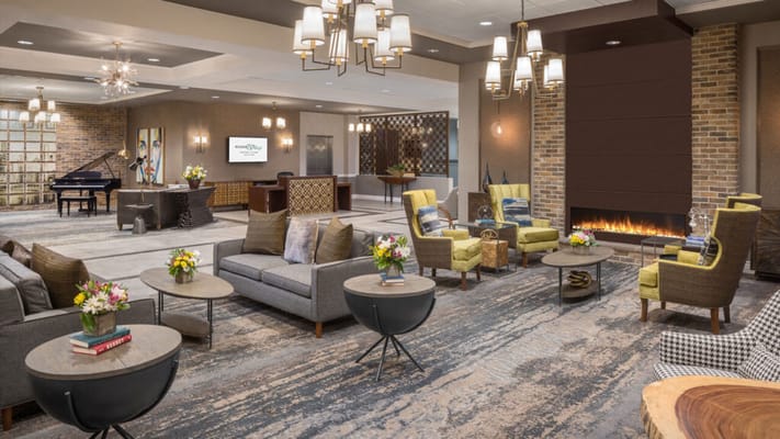 Modern lounge area with comfortable seating and flowers