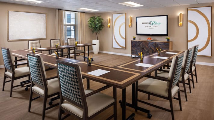 Interior meeting room setup with tables and chairs