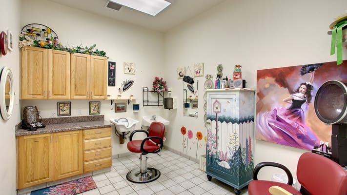 Hair salon area with styling chairs and decor