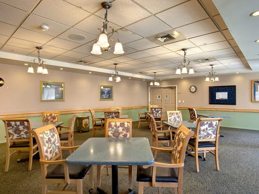 Dining area with tables and chairs in a common space