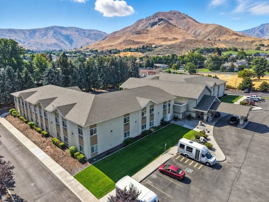 Aerial view of Blossom Valley assisted living facility with mountains in the background