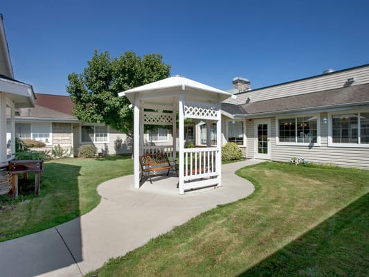 A gazebo in a landscaped courtyard area