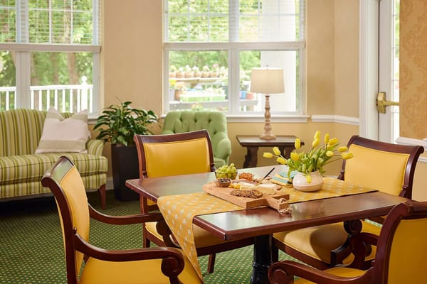 Bright common area with dining set and decor