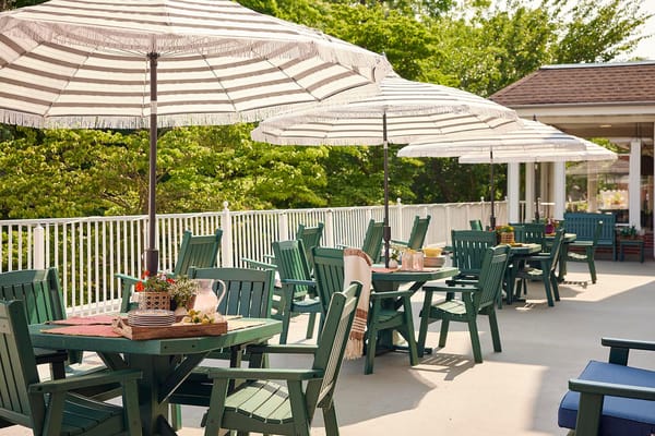 Outdoor dining space with tables and umbrellas