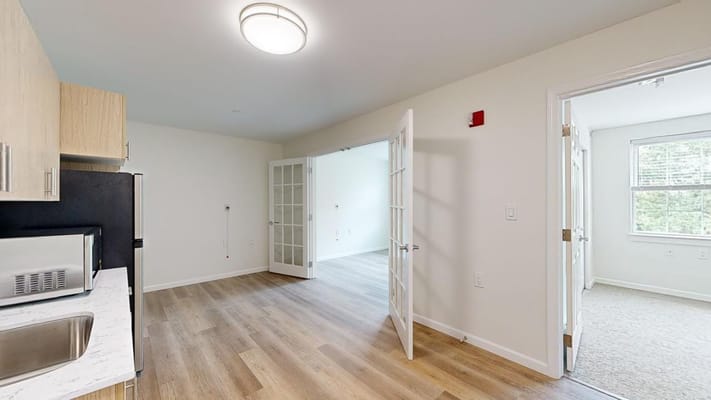 Interior view of a resident room with kitchen area