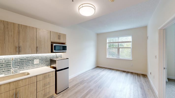 Modern interior of a studio apartment with kitchen area