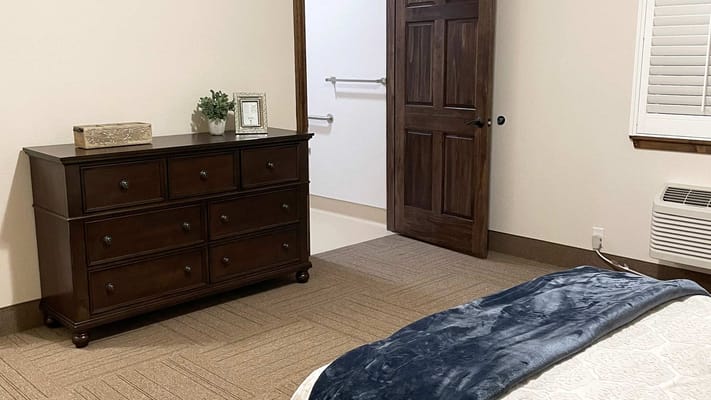 Well-furnished bedroom in a senior living facility