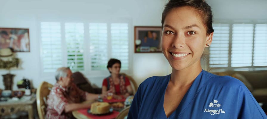Staff member interacting with residents during a meal