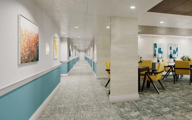 Bright, well-decorated common area with seating and artwork