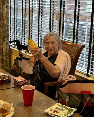 Resident holding a gift in a common area