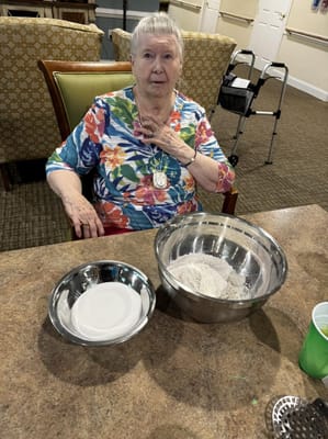 A resident engaged in an activity at a table.