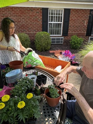 Residents gardening together in the outdoor area