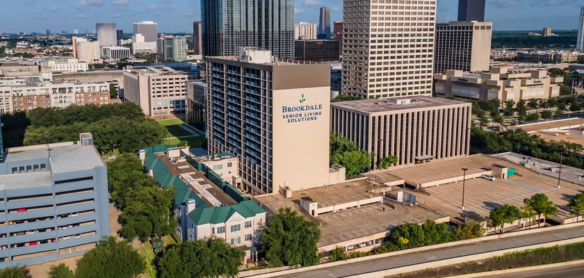 Aerial view of Brookdale Galleria building with logo