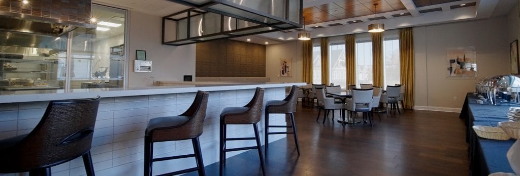 Bright dining room with a bar and seating area