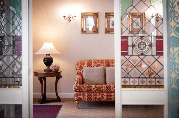 Cozy seating area with decorative window panels