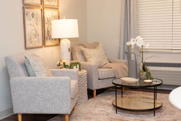 Cozy sitting area with comfortable chairs and decor