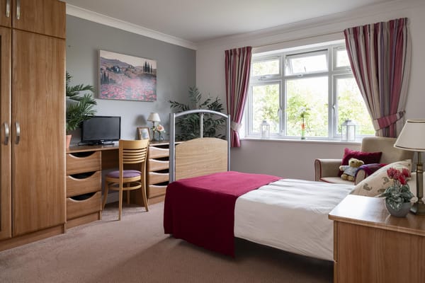 Comfortable resident room with warm decor